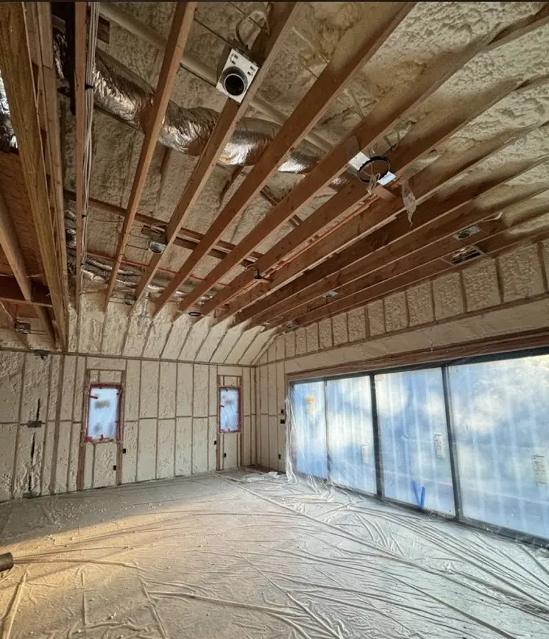 Interior walls and ceiling insulated with spray foam during new construction in West Springfield Town